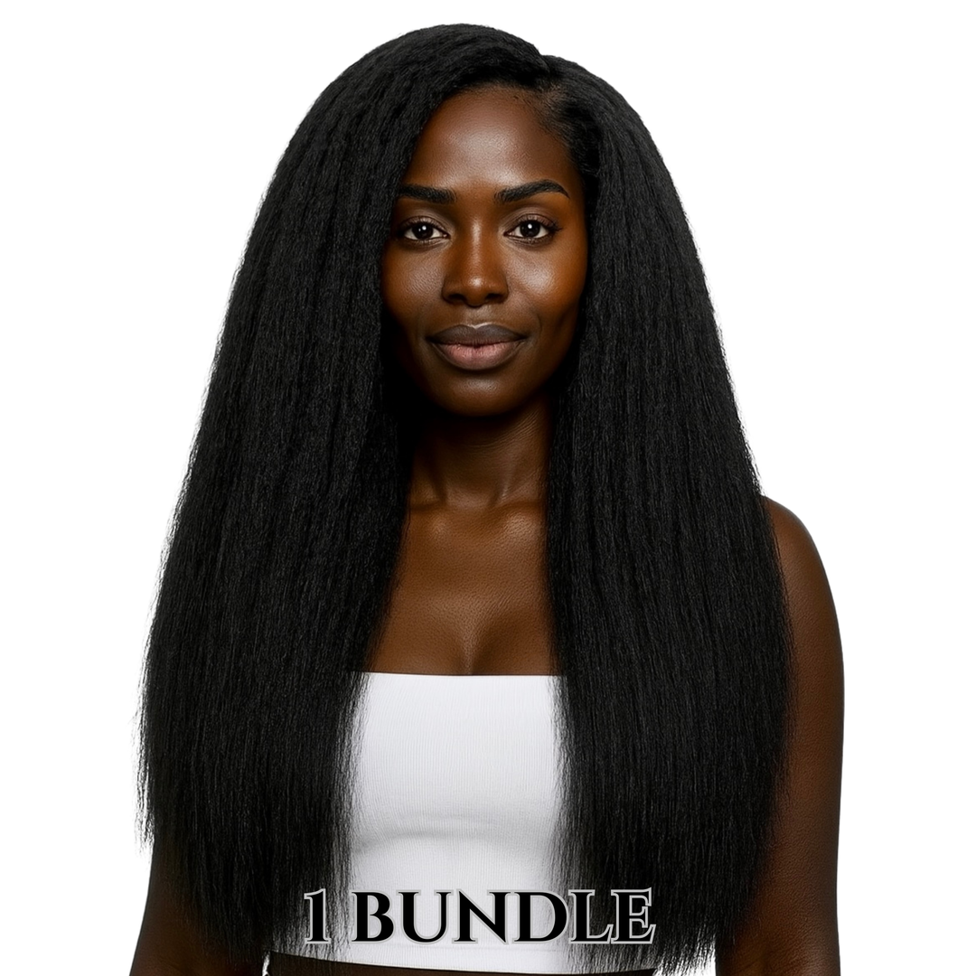 Smiling woman with long, voluminous raw kinky straight black hair wearing a white crop top against a plain white background.
