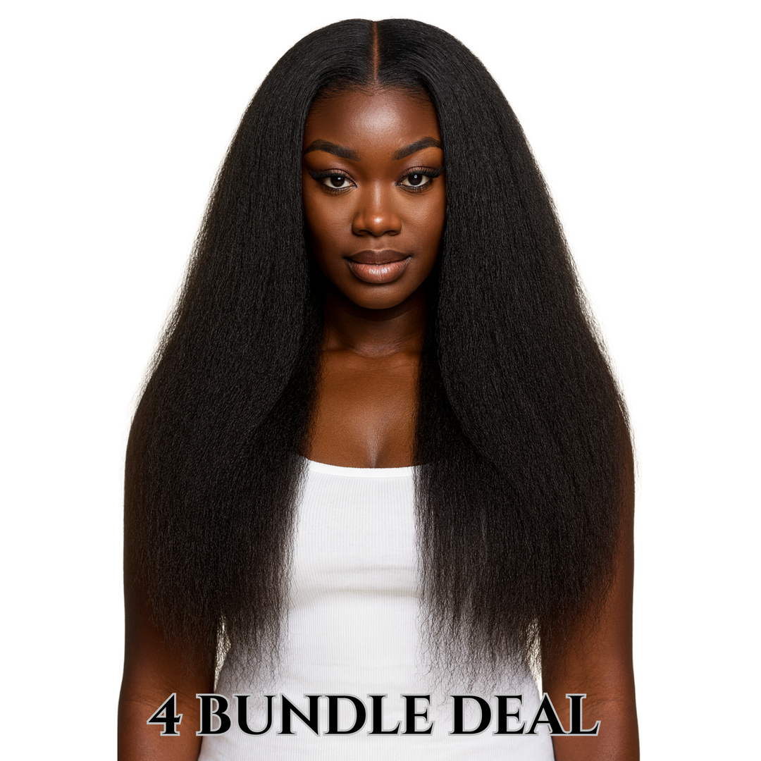 Smiling woman with long, voluminous  Lux lash and hair raw kinky straight black hair wearing a white top against a plain white background