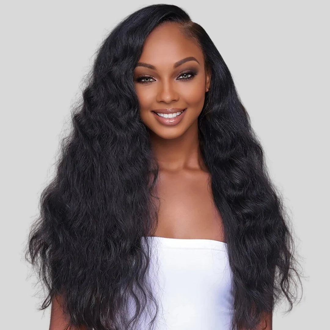 Model wearing Lux Lash and Hair Raw Cambodian Natural Wave hair extensions, long length, natural black, styled with a side part and soft waves.