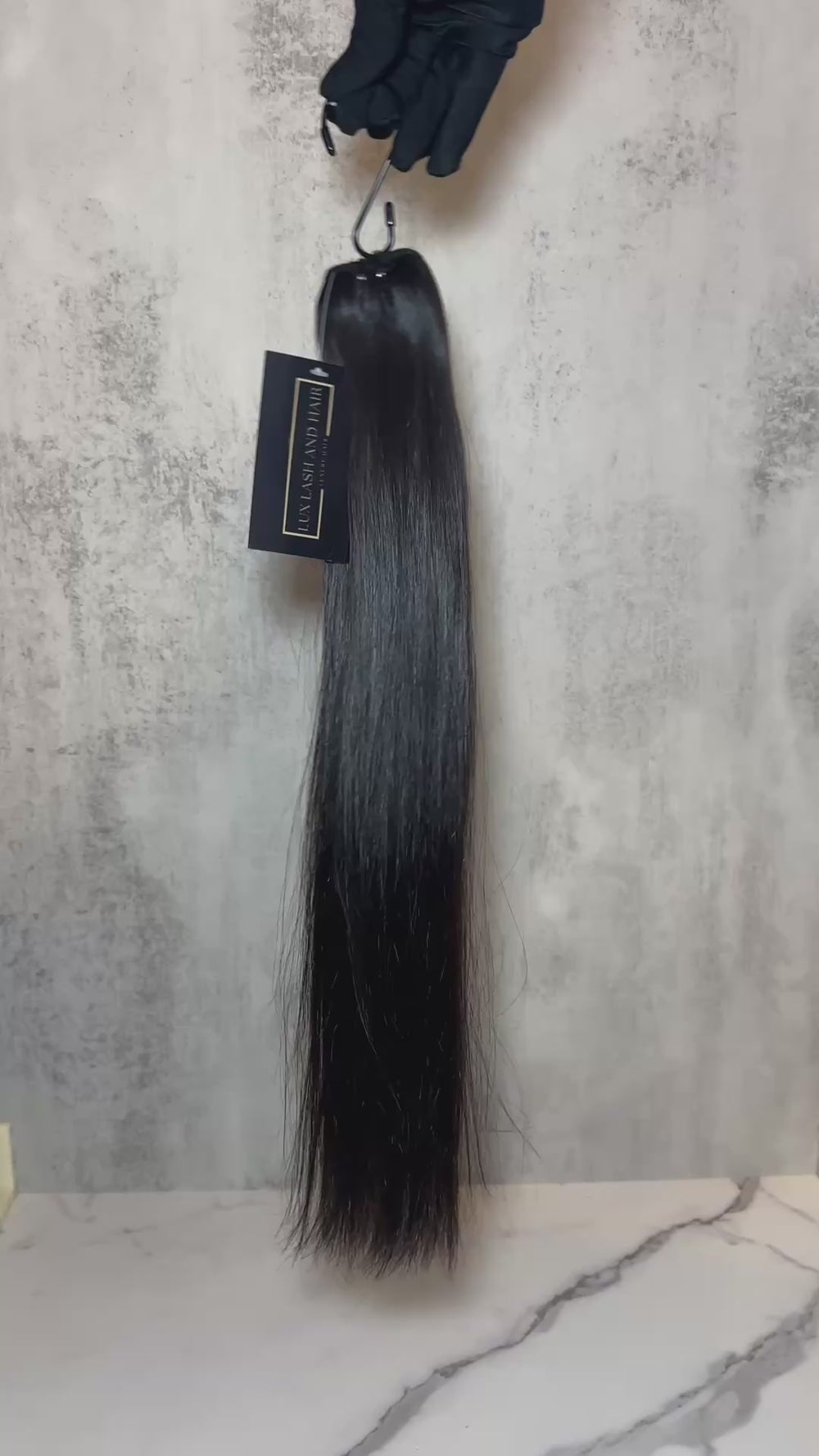 view of a single Raw Vietnamese Straight Hair bundle, showcasing its silky, unprocessed texture and natural black color